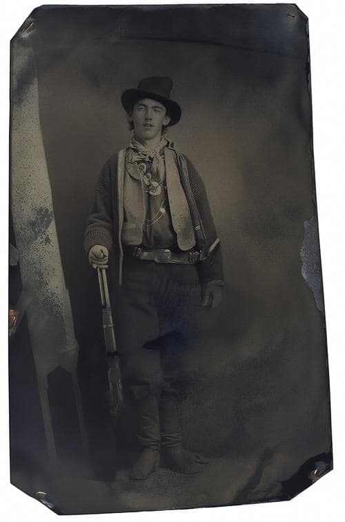 Restored: A young man with a rifle, photographed on a tintype around 1880