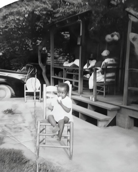 Restored: A child on a porch, photographed in 1952