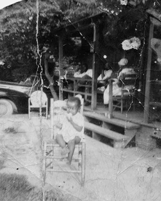 Original: A child on a porch, photographed in 1952