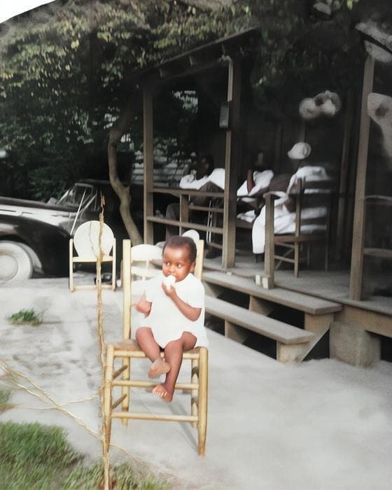 Colorized: A child on a porch, photographed in 1952